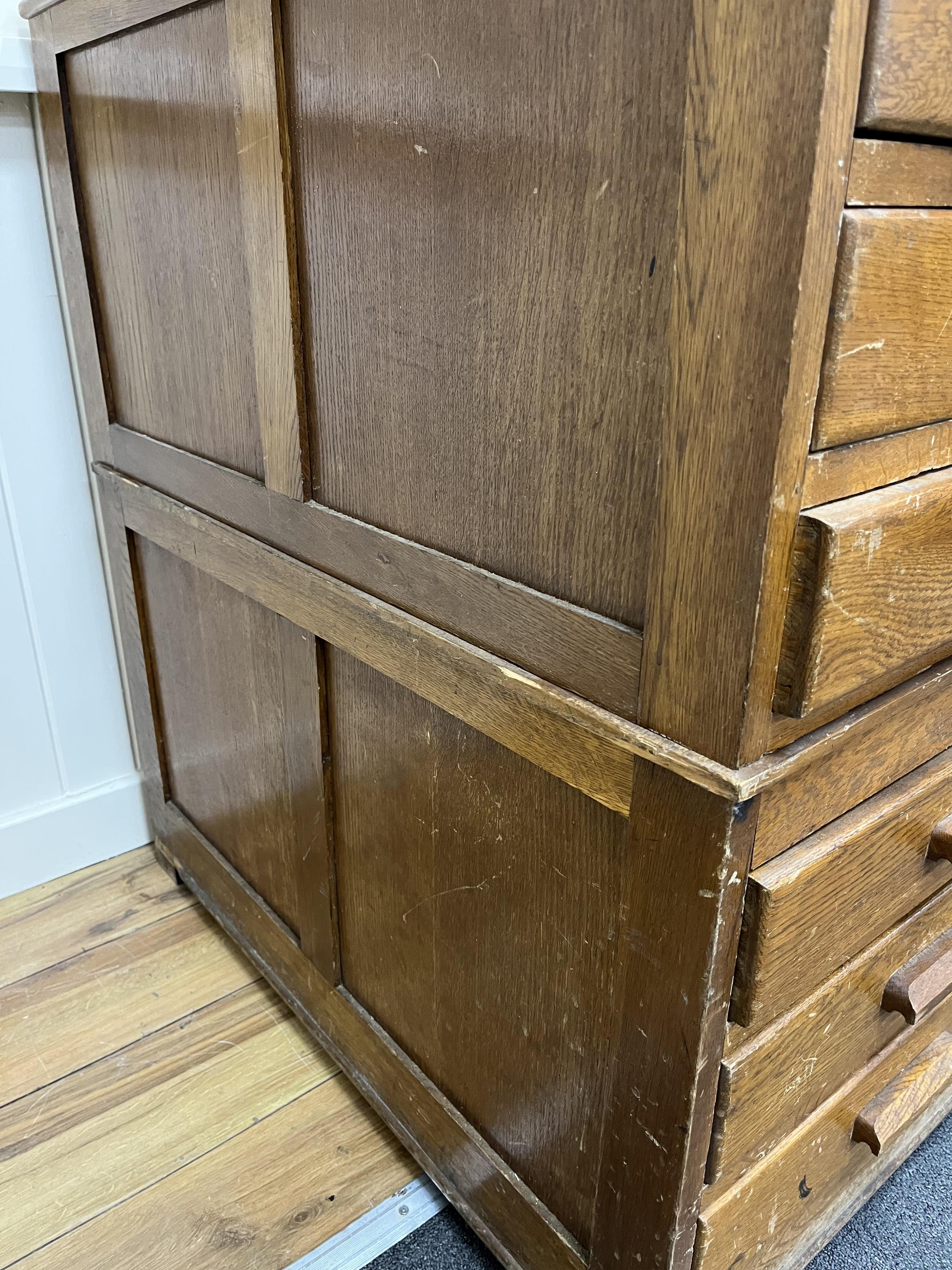 A 1930's light oak plan chest in two sections, width 113cm, depth 82cm, height 92cm